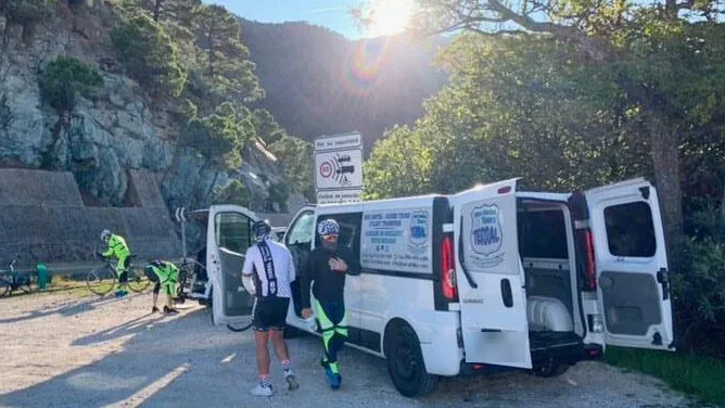 Cyclists loading their bikes into the transfer van in the mountains of Malaga